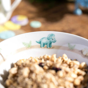 Kindergeschirr BAMBINI AVVENTURA mit Dino-Motiv und Schale mit Getreide