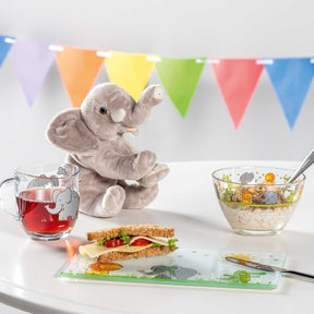 Tasse BAMBINI mit Elefantenmotiv, Frühstückstisch mit Sandwich, Müslischale und Getränk