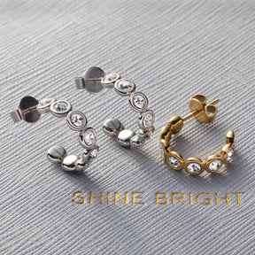 Ohrstecker CREMONA in Silber und Gold mit Zirkonia-Steinen in Reihe angeordnet