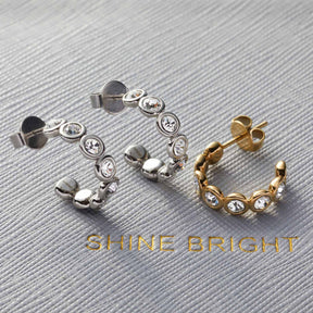 Ohrstecker CREMONA in gold und silber mit Zirkonia-Steinen, nebeneinander angeordnet