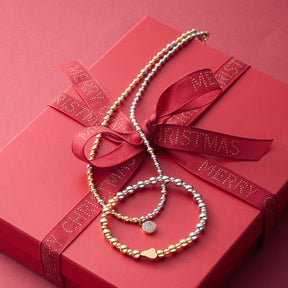 Halskette ODELLE auf rosa Geschenkbox mit rotem Samtband