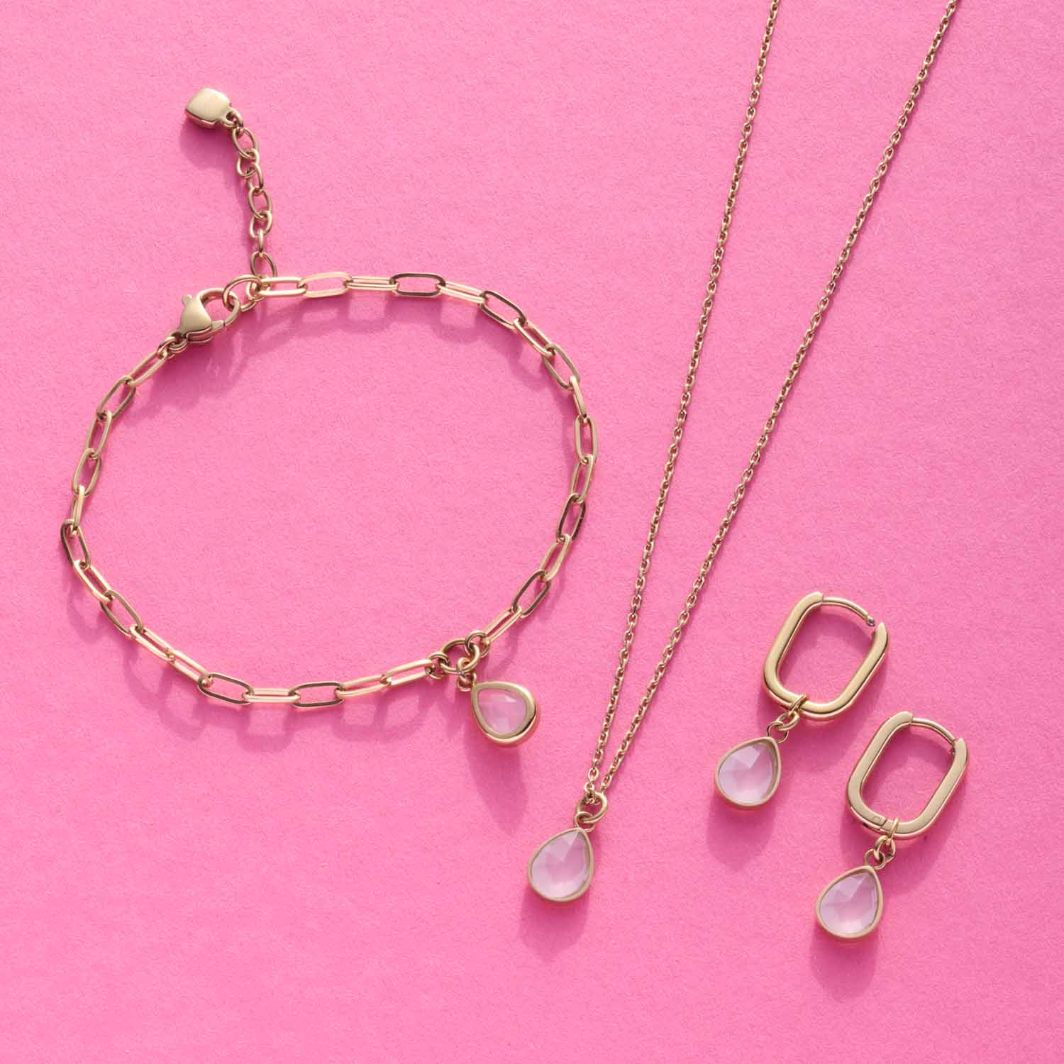 Ohrhänger ROSY gold CIAO, Armband und Halskette auf rosa Hintergrund