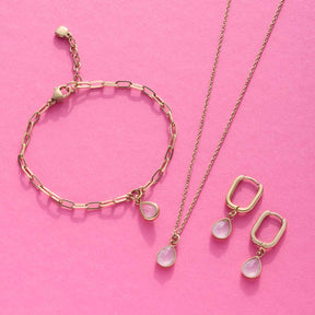 Ohrhänger ROSY gold CIAO, Armband und Halskette auf rosa Hintergrund