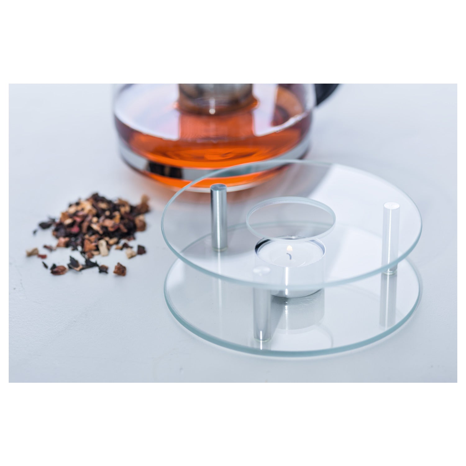 Stövchen SCALDINO aus Glas mit Teekanne und Kaffeebohnen