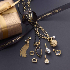 Anhänger HANNA Clip & Mix gold mit austauschbaren Charms auf Geschenkbox