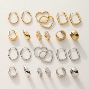 Creole LUZIE gold in verschiedenen Formen und Designs, sortiert in Reihen mit gold- und silberfarbenen Varianten