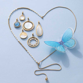 Anhänger MINKA gold Clip & Mix mit blauem Schmetterling