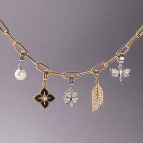 Anhänger REIJA gold Clip & Mix mit vier verschiedenen Charms an Gliederkette