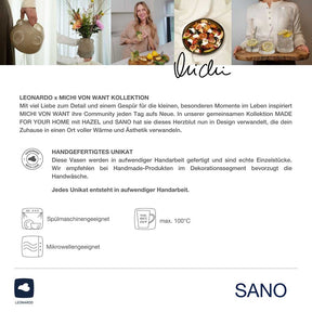 ToGo Becher SANO in Wohnumgebung mit Blumen und Speisen