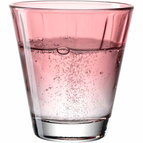 Trinkglas TWIST gefüllt mit rosa Flüssigkeit und Kohlensäurebläschen