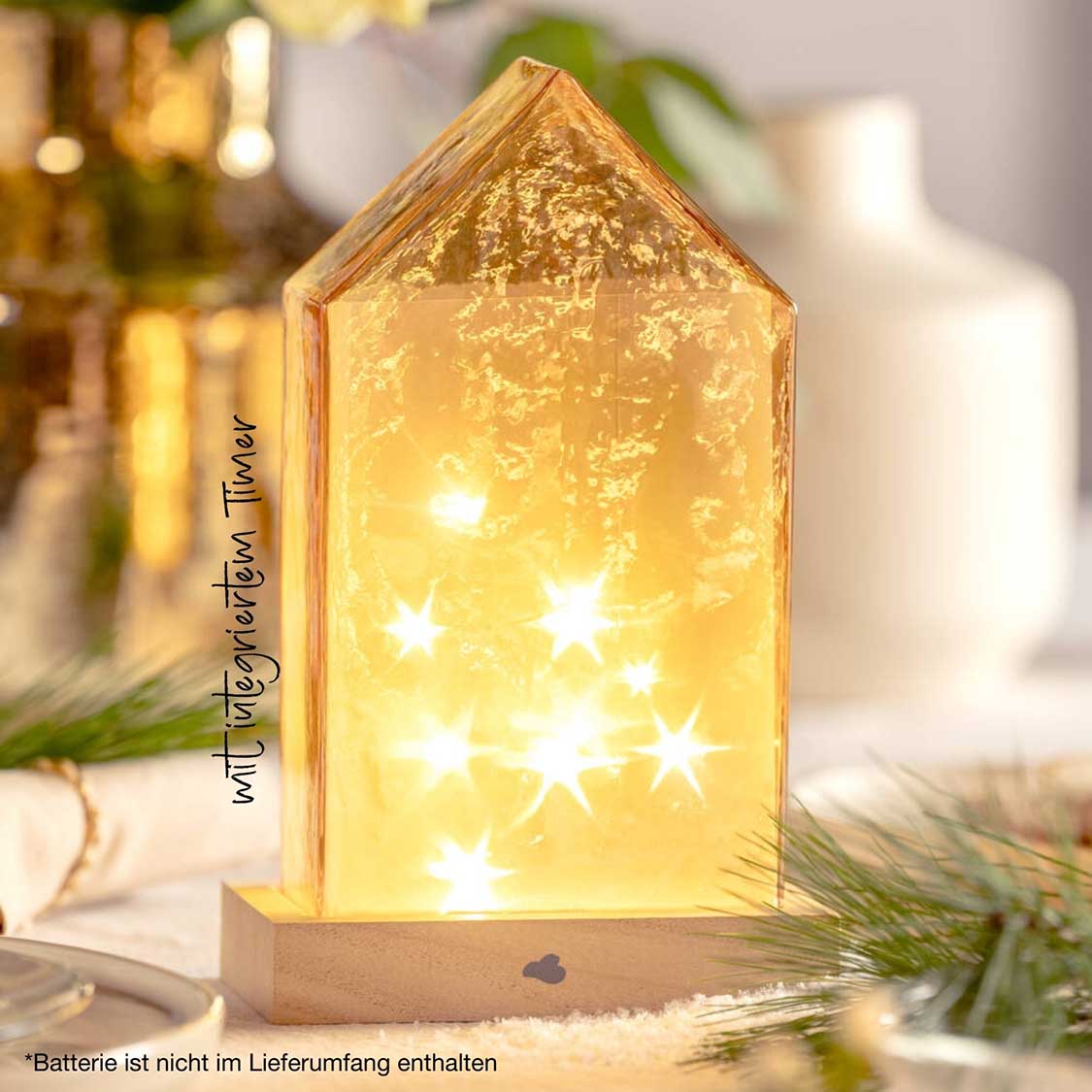 LED Haus 22 cm amber MAGICO mit leuchtenden Sternen auf Tisch mit Deko