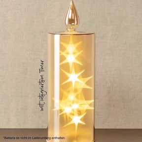 LED Kerze CAPANNA 27 cm gold mit leuchtenden Sternen, vor beigem Hintergrund