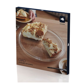 Tortenplatte CIAO mit Kuchenstücken auf Holztisch, Kaffeetasse sichtbar