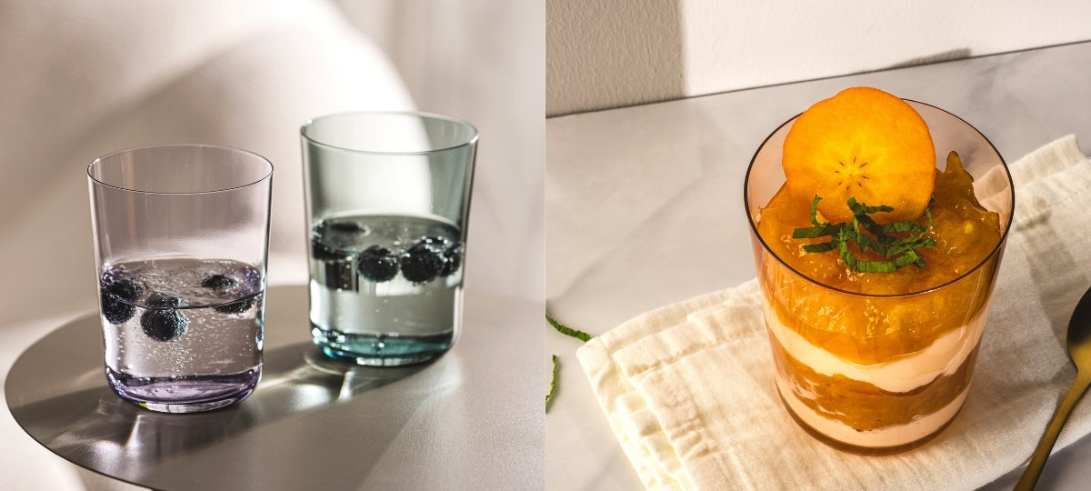 Moderne Trinkgläser und Desserts im Glas werden mit frischen Zutaten und sommerlichen Farben stilvoll präsentiert.