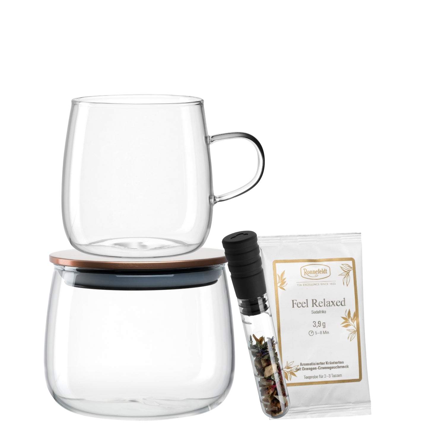 Eine Glas-Dose, ein Teeglas, ein Teeinfuser + Tee